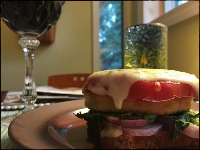 Stacked with fresh tomatoes.